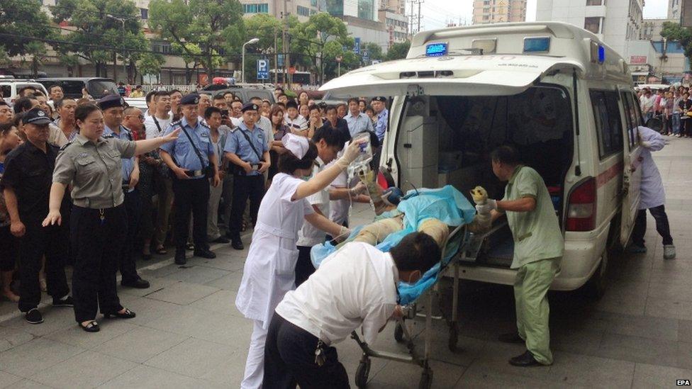 Injured person put aboard an ambulance, 2 Aug