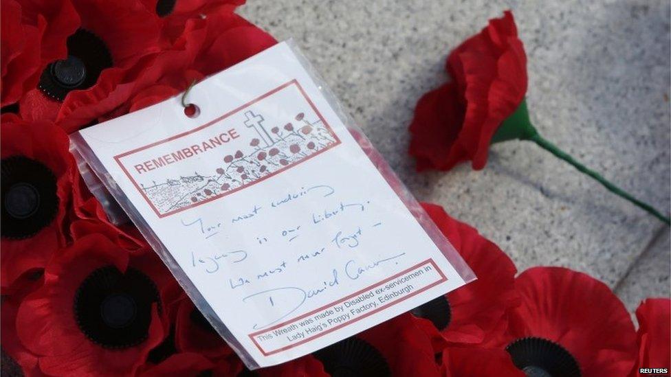 A message on a wreath laid by Prime Minister David Cameron is seen at the Cenotaph in Glasgow