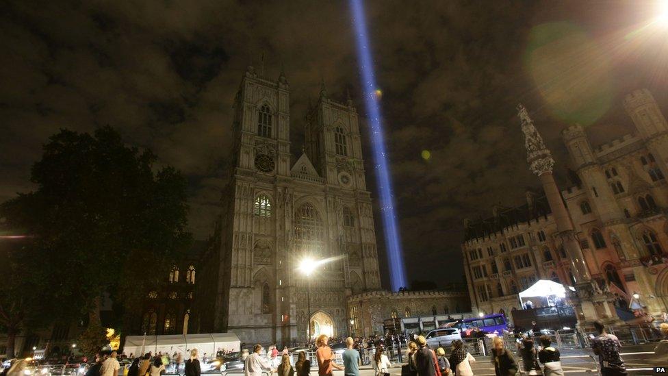 A column of white light projected into the sky above Westminster Abbey, in London