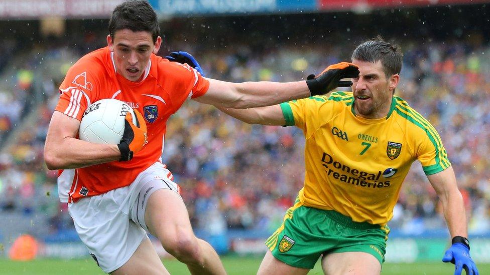 Rory Grugan of Armagh in possession against Donegal's Paddy McGrath during a closely-contested All-Ireland quarter-final at Croke Park