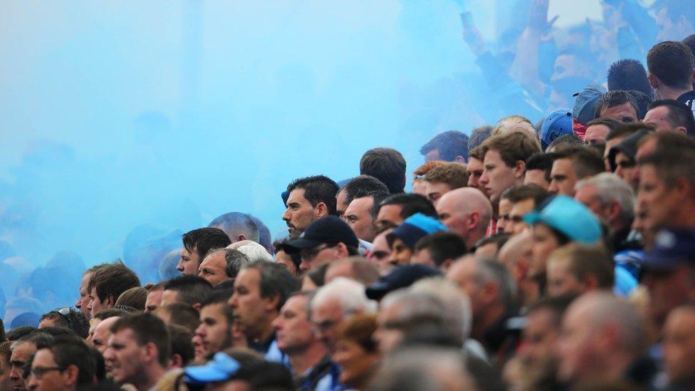 The blue of Dublin fills the air as home supporters on Hill 16 at Croke Park watch the All-Ireland champions power past Monaghan in the 2014 quarter-finals