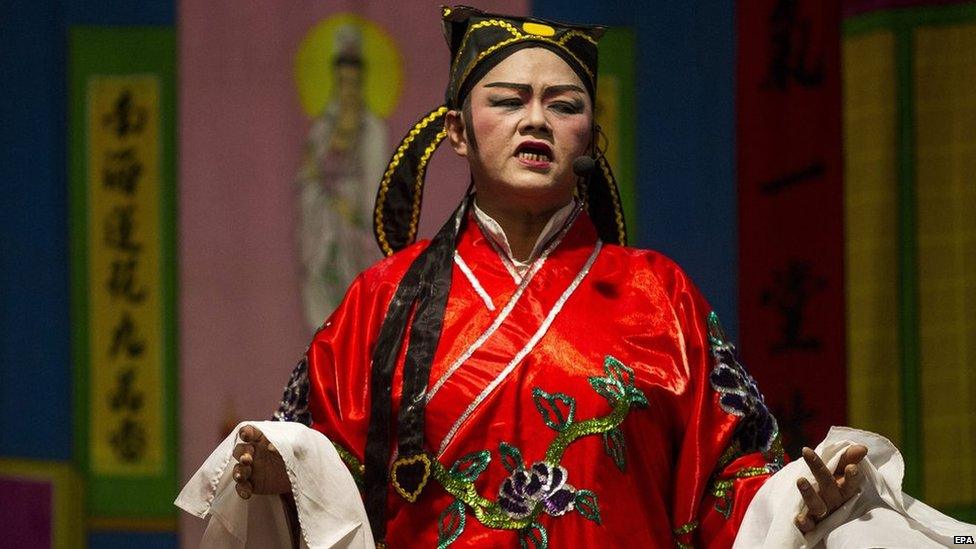 A Malaysian ethnic Chinese performs a scene of an opera based on popular Chinese myths and legends during the Hungry Ghost Festival in Kajang, outside Kuala Lumpur, Malaysia, late 05 August 2014