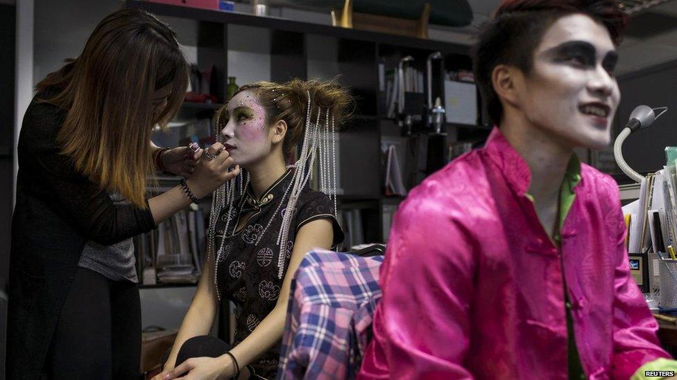 A model has is made up to look like a Chinese ghost before a "Funeral Fashion Show" during the Chinese Hungry Ghost Festival in Hong Kong on 10 August, 2014