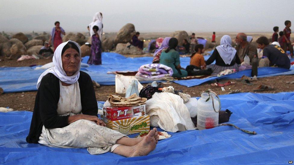 Displaced Iraqis from the Yazidi community settle at a camp at Derike, Syria, on 10 August 2014. Kurdish authorities at the border believe some 45,000 Yazidis passed the river crossing in the past week and thousands more are still stranded in the mountains.