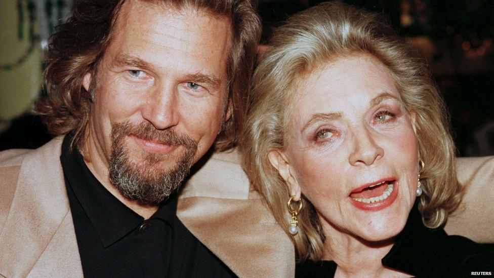 File photo: Actor Jeff Bridges and actress Lauren Bacall, cast members of the film "The Mirror Has Two Faces", pose together during the film's post-premiere party in New York, 10 November 1996