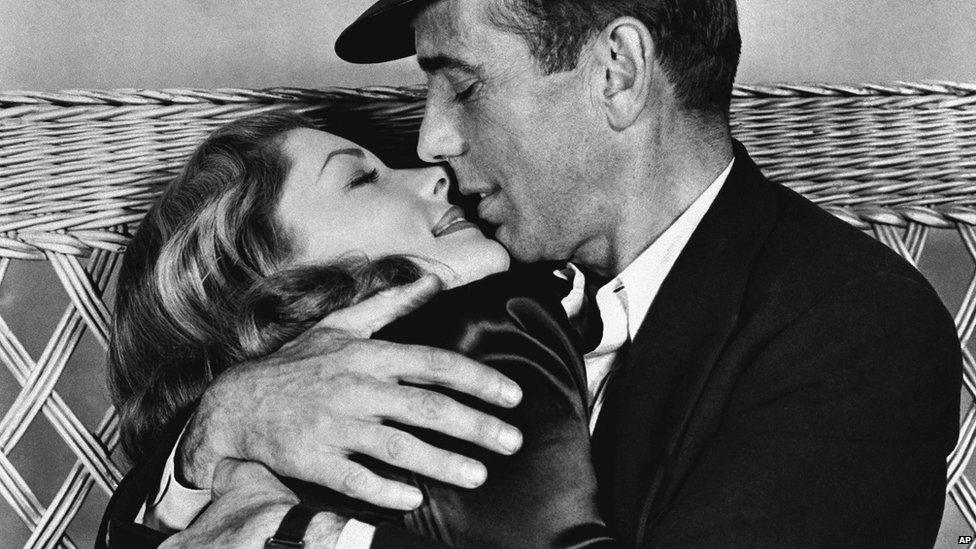 File photo: Actor Humphrey Bogart, right, holding actress Lauren Bacall in a scene from, "To Have and Have Not", 1944