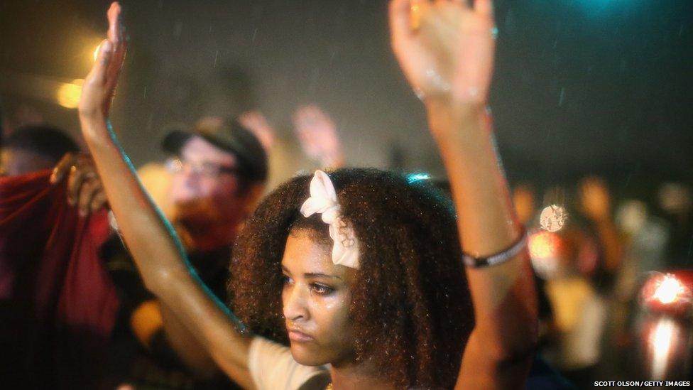 Demonstrators protest Michael Brown"s murder August 16, 2014 in Ferguson, Missouri