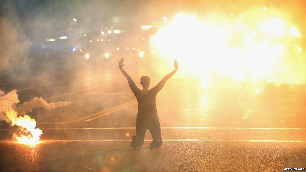 Protester holds hands up in Missouri