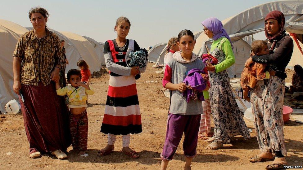 Two families found by Kurdish forces in the mountains two hours before this photo was taken, on 15 August 2014