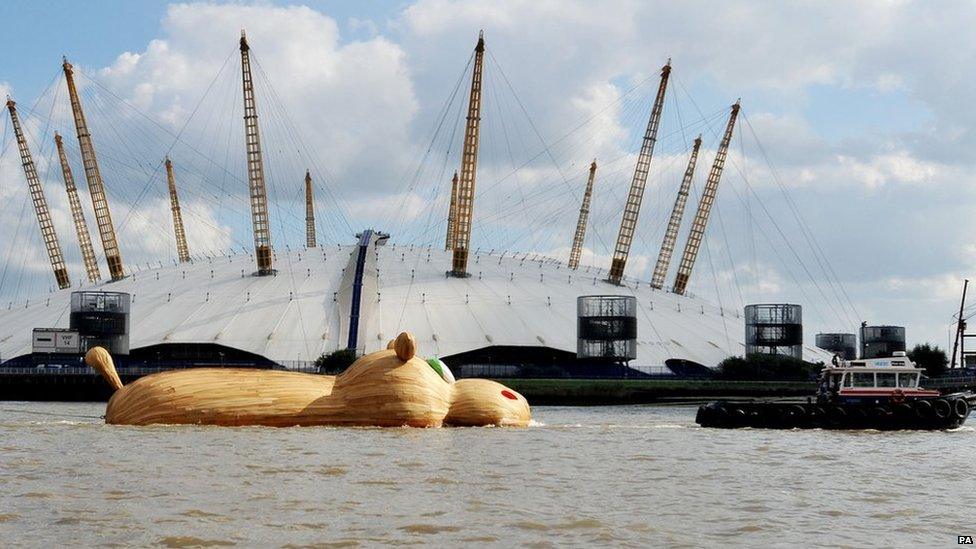 Giant hippo structure floating past O2 Arena