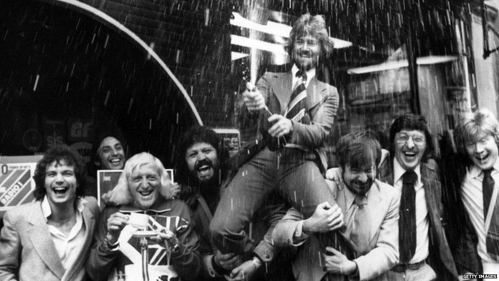 Dave Lee Travis helping Noel Edmonds celebrate his departure from the Radio 1 Breakfast Show