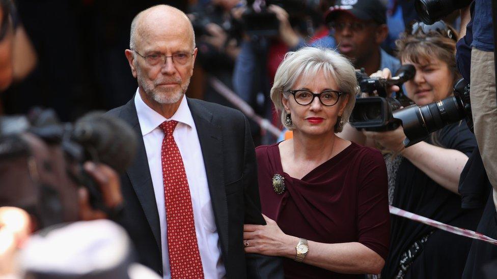 Lois and Arnold Pistorius, the aunt and uncle of Oscar Pistorius, leave North Gauteng High Court in Pretoria, South Africa, 12 September 2014