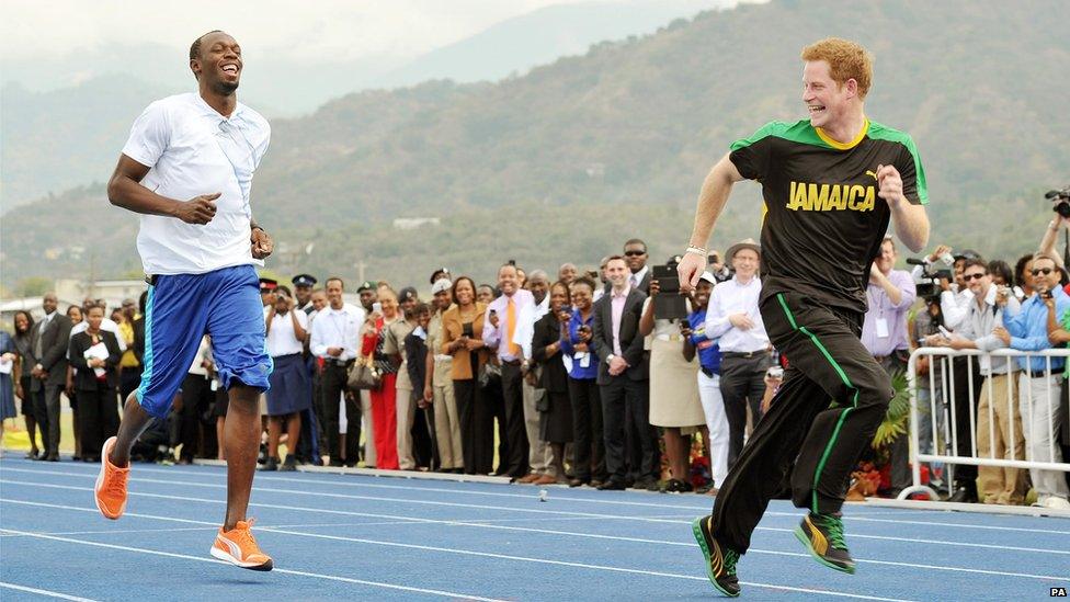 Harry sprinting with Olympic 100m champion Usain Bolt