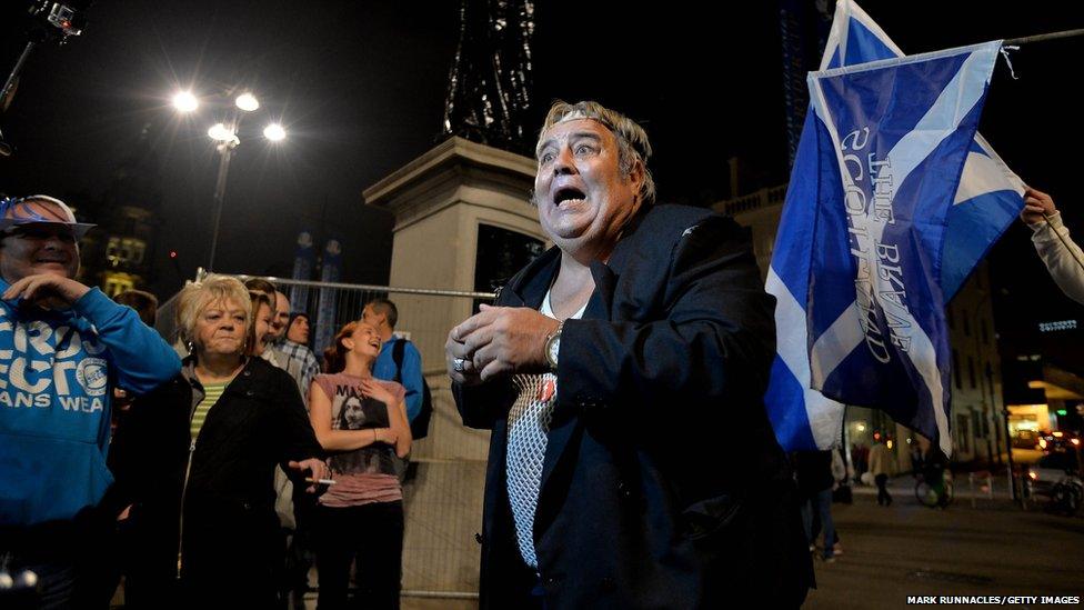 A man dressed as Scottish cult TV character Rab C Nesbitt entertains the crowd at a "Yes" rally in George Square, Glasgow