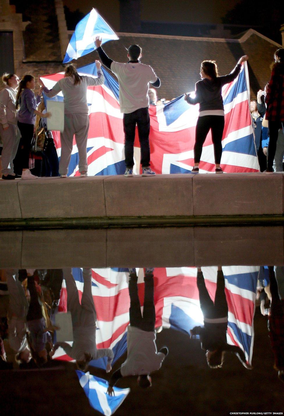 People wait for the result outside the Scottish Parliament in Edinburgh