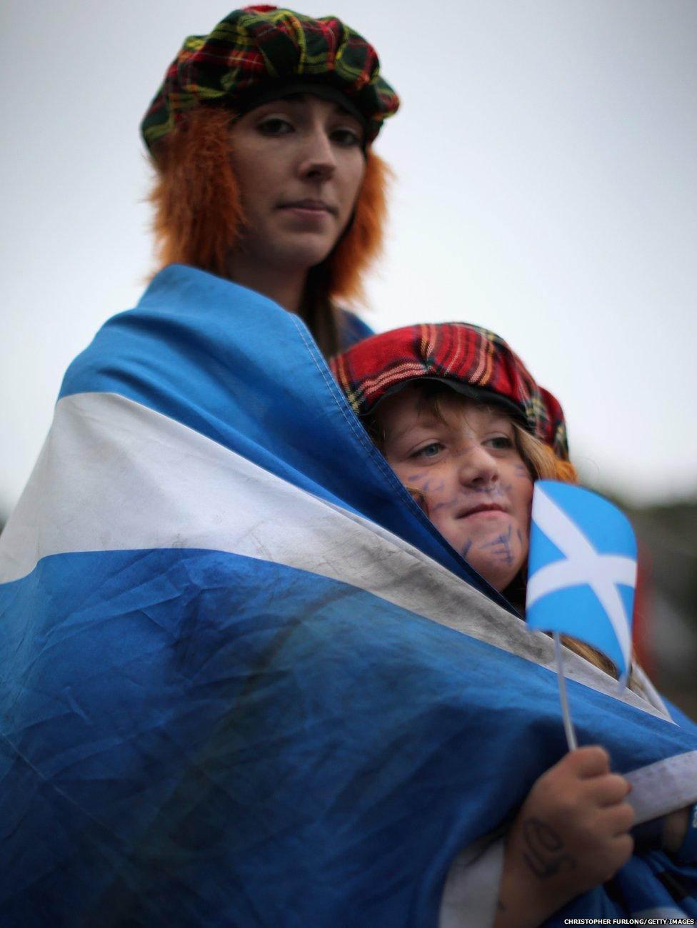 Debbie Ramsay, aged 24 and Gian Smith, aged eight, wait outside the Scottish Parliament