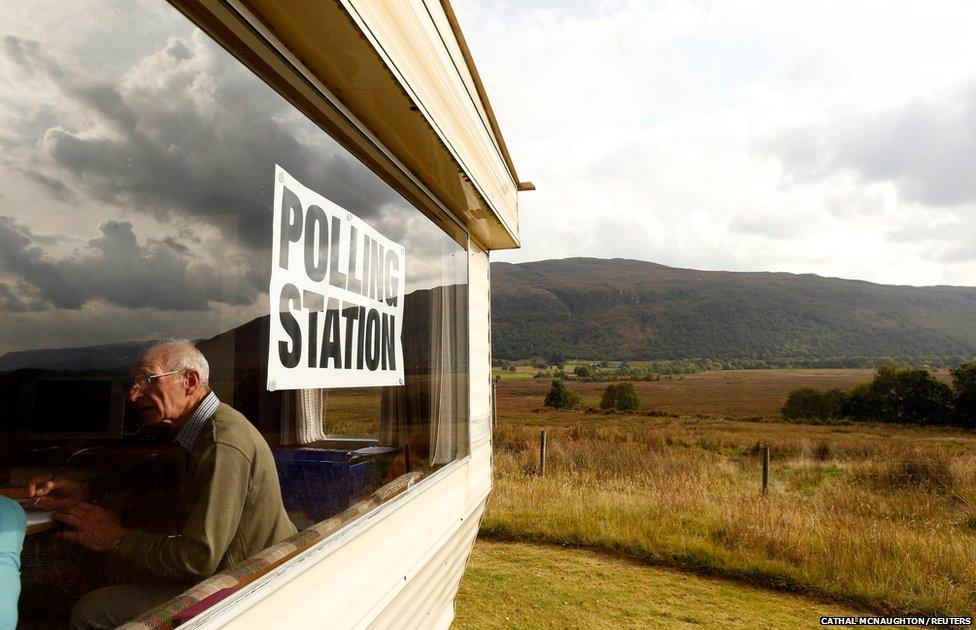 Poll clerk George MacKay sits in the Coulags caravan polling station, in the Scottish Highlands