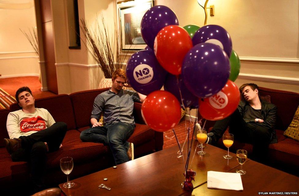 Supporters from the "No" Campaign sleep as they wait for the announcement of results, at the Better Together Campaign headquarters in Glasgow