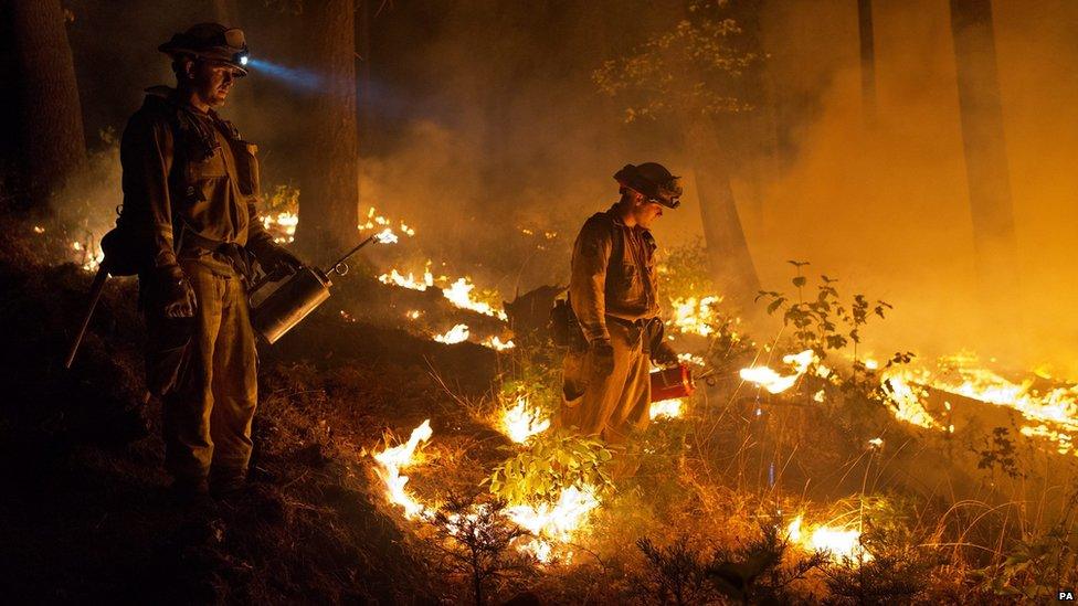 Fire-fighters putting out flames