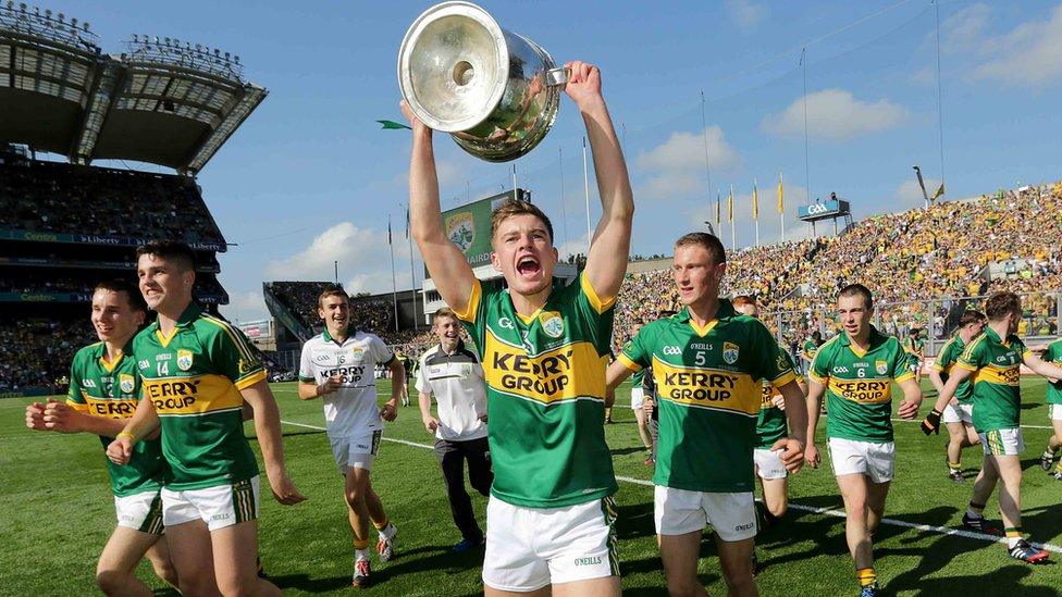 Ivan Parker holds the Tom Markham Cup loft as Kerry celebrate their 0-17 to 1-10 victory over Donegal in the minor decider