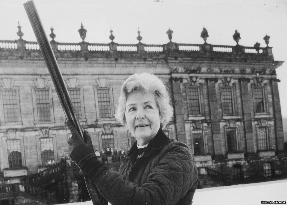 The Dowager Duchess of Devonshire outside Chatsworth House with a big gun