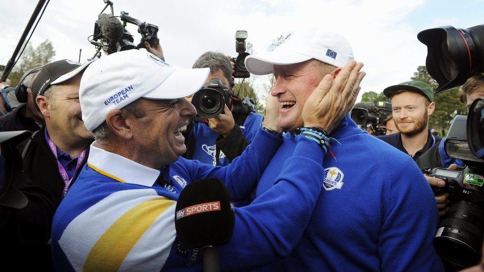 Europe team captain Paul McGinley congratulates Jamie Donaldson