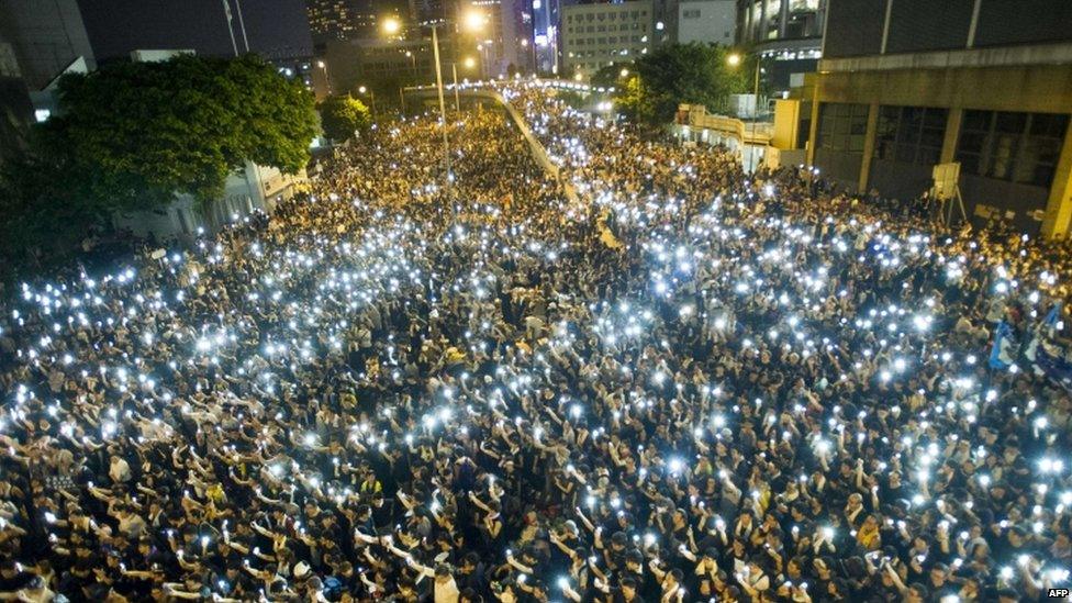 Demonstrators hold up their mobile phones in a show of solidarity in Hong Kong. Photo: 29 September 2014