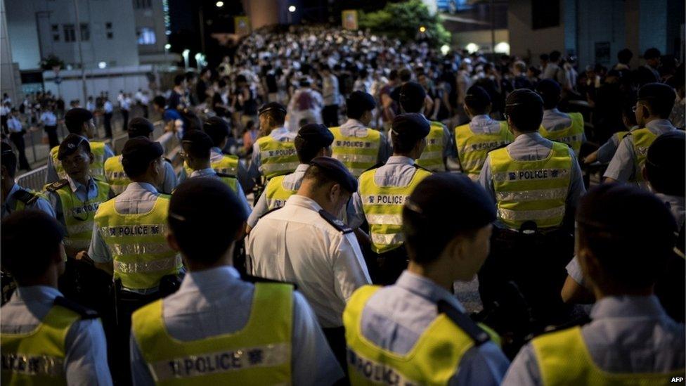 Hong Kong police face protesters. Photo: 29 September 2014