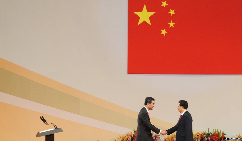 CY Leung shakes hands with Chinese President Hu Jintao at his inauguration in Hong Kong (1 July 2012)