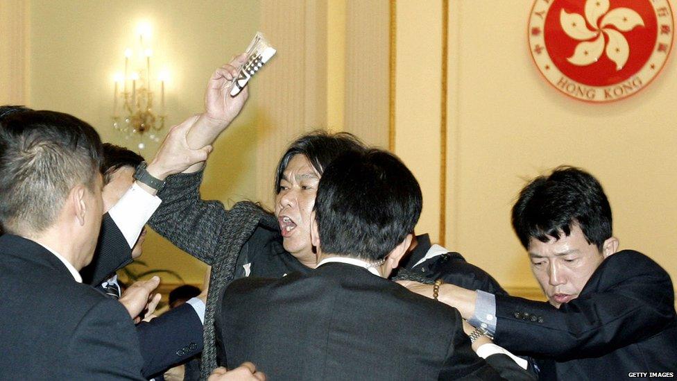 Lawmaker and pro-democracy activist Leung Kwok-hung is removed from a forum addressed by Donald Tsang (29 Dec 2007)