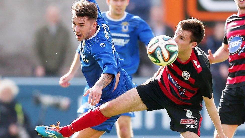 Josh Barton of Dungannon Swifts in action against Coleraine's Adam Mullan