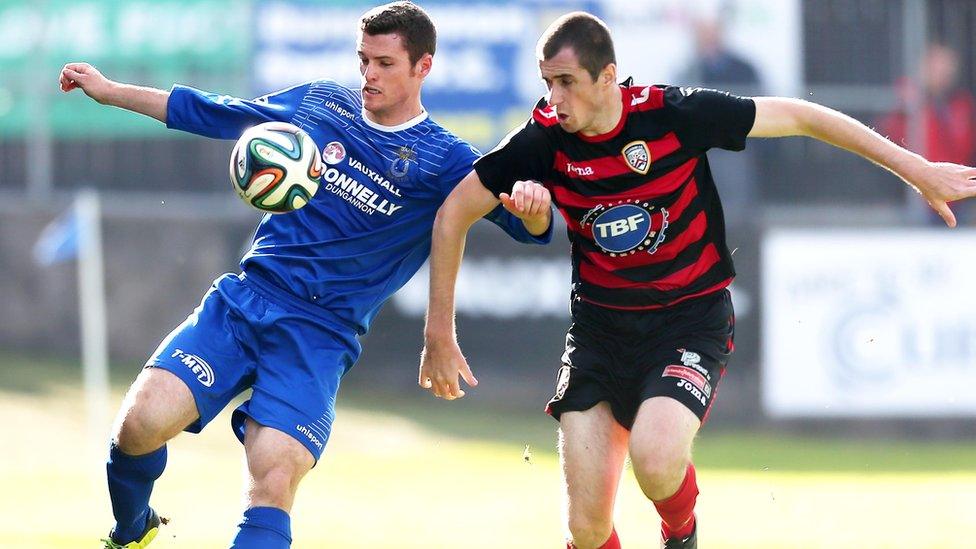 Gary Liggett of Dungannon Swifts in action against David Ogilby who grabbed Coleraine's goal in their 1-0 win at Stangmore Park