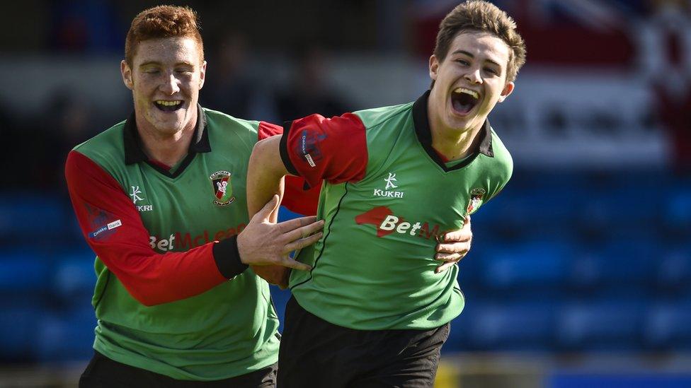 Kym Nelson congratulates Jordan Stewart after the teenager scored the first goal in Glentoran's 2-1 away win over Glenavon