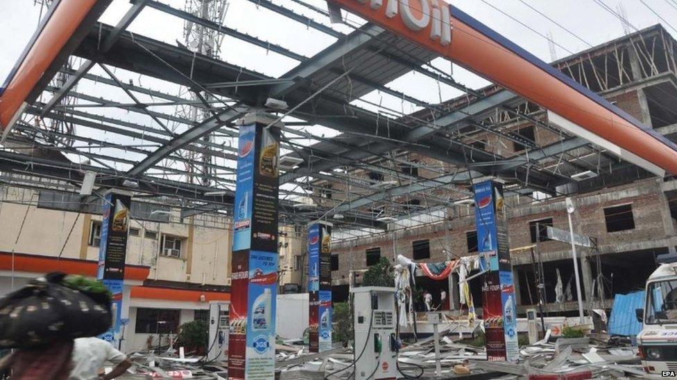 Damaged and shattered roof of a filling station is seen after cyclone Hudhud's land fall in Vishakapatnam in the Indian state of Andhra Pradesh, India on 13 October 2014.