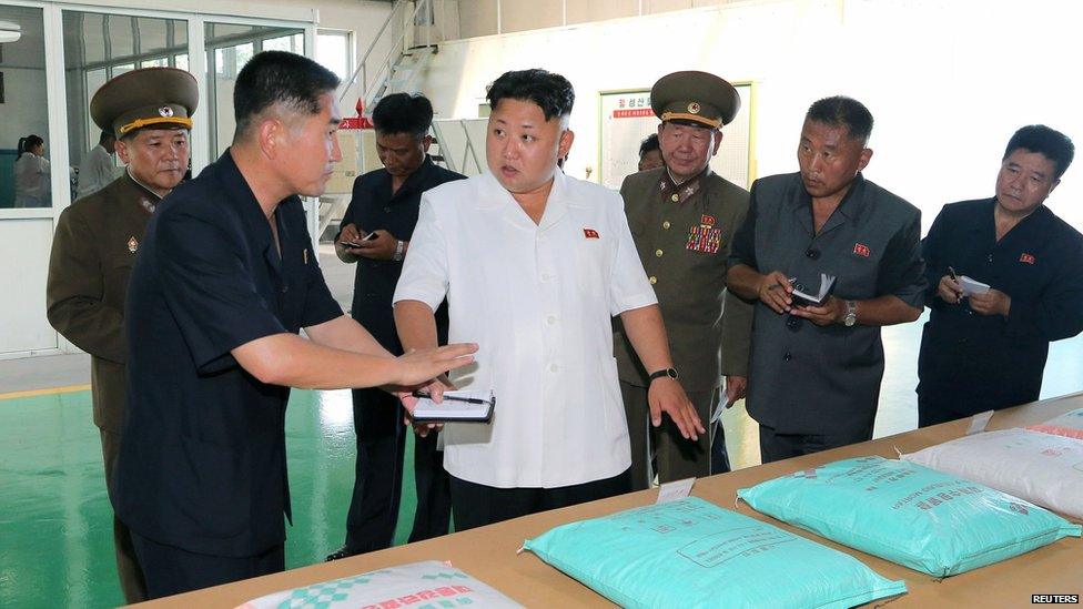 Kim Jong-un provides guidance during his visit to the Chollima Tile Factory