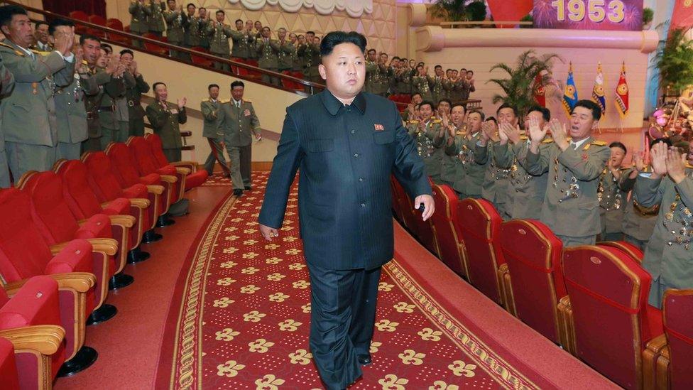 Kim Jong-un walking through a theatre.