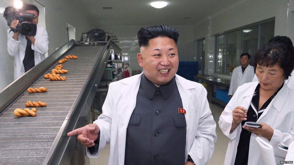 Kim Jong-un in a food factory.