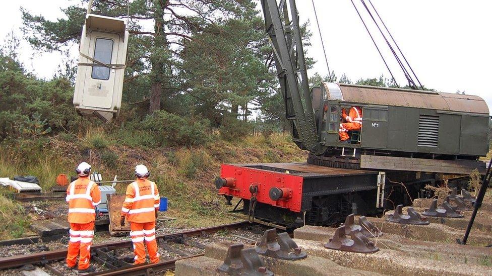 Signalling hut being removed