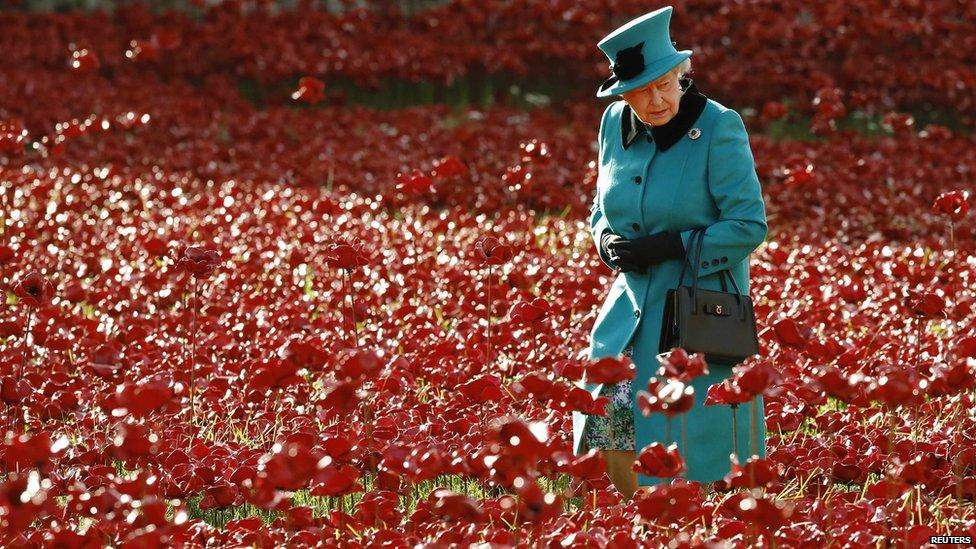 The Queen looking at the ceramic poppies