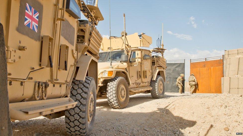 Soldiers from 4 Scots close the gates of patrol base Sterga 2 for the final time as they prepare to leave the site in Helmand on 10 May 2014