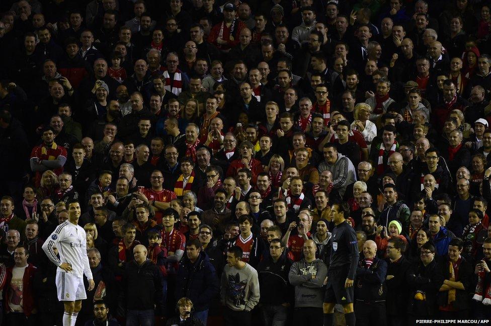 Real Madrid's Portuguese forward Cristiano Ronaldo reacts in front of Liverpool fans