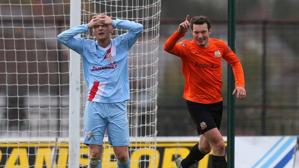 Contrasting emotions on show at the Showgrounds as Ballymena's Stephen McBride watches Glenavon's Kyle Neill celebrate his opening goal