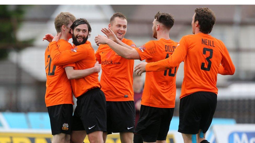 Glenavon players gather to congratulate Rhys Marshall after the full-back scores the third goal in his side's 4-1 win