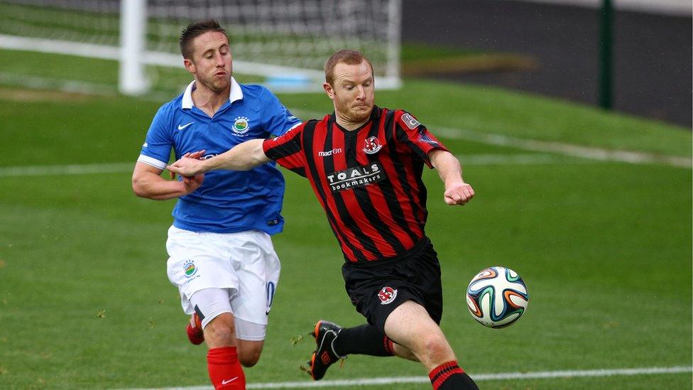 Michael Carvill and David Magowan vie for possession as Linfield go down to Crusaders who are now third in the table