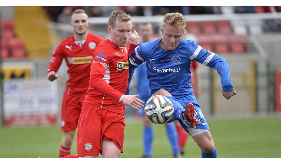 Chris Curran and John Curran contend for the ball during Cliftonville's 3-2 victory over Ballinamallard