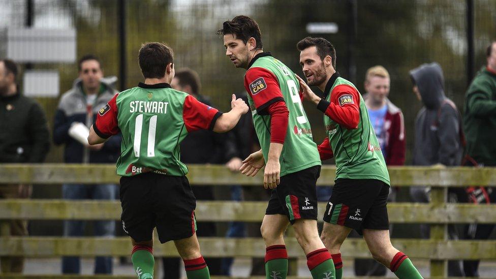 Glentoran hat-trick hero Curtis Allen is greeted by team-mates Jordan Stewart and David Scullion at Milltown