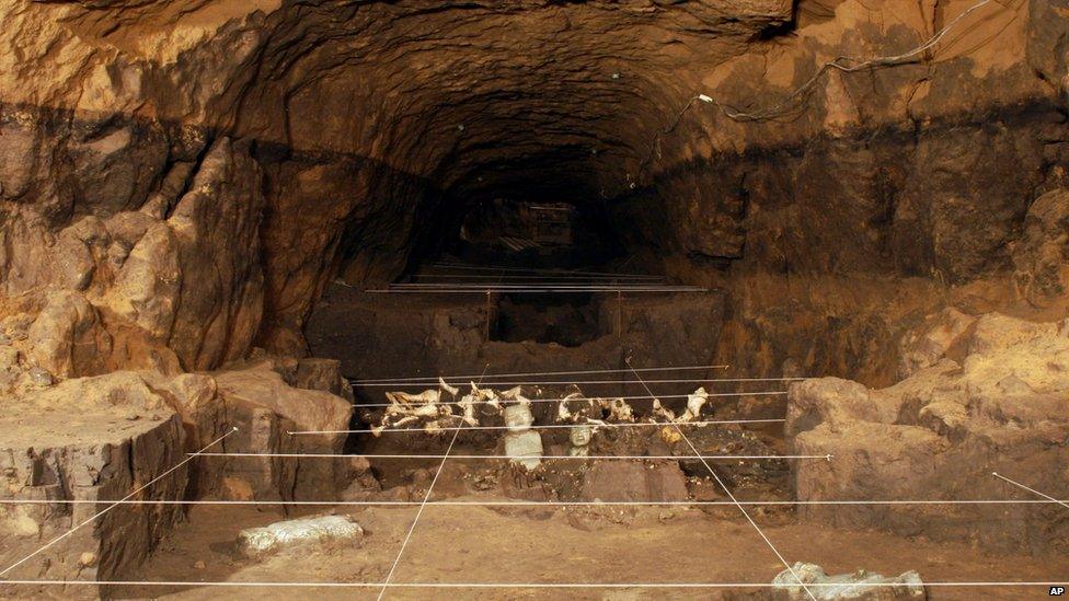 This May 22, 2014 photo released by Mexico's National Institute of Anthropology and History (INAH), shows sculptures and shells unearthed by investigators at the Teotihuacan archaeological site in Mexico.