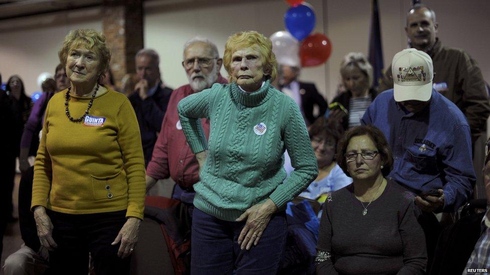 Supporters of Republican US Senate candidate Scott Brown watch at his rally in Manchester, New Hampshire. 4 Nov 2014