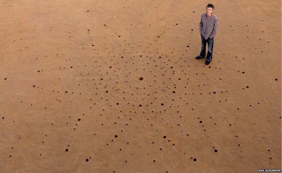 A diffraction pattern drawn on sand in Porthcawl beach in South Wales