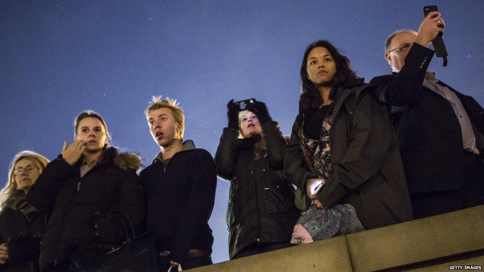 People looking at the ceramic poppies at the Tower of London